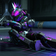 A Spartan wearing a neon mohawk slides in Halo Infinite while shooting a pistol.